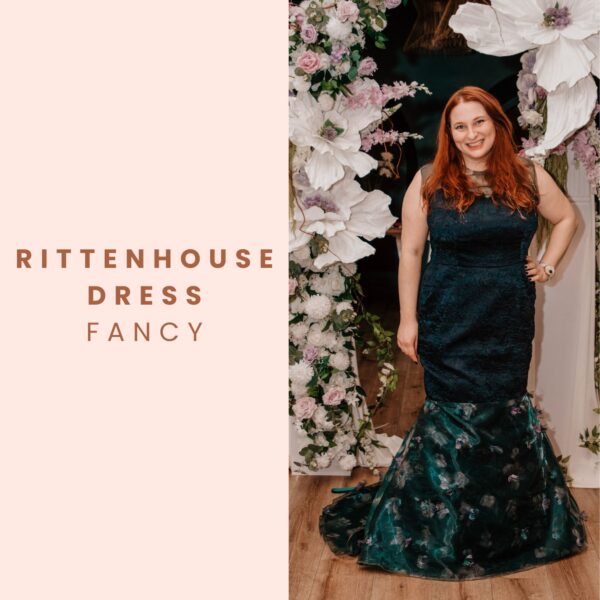 A woman with long red hair models a dark green, floral Rittenhouse Dress Pattern gown in front of a flower arch. Next to her, on a light pink background, is the text: "Rittenhouse Dress Pattern.